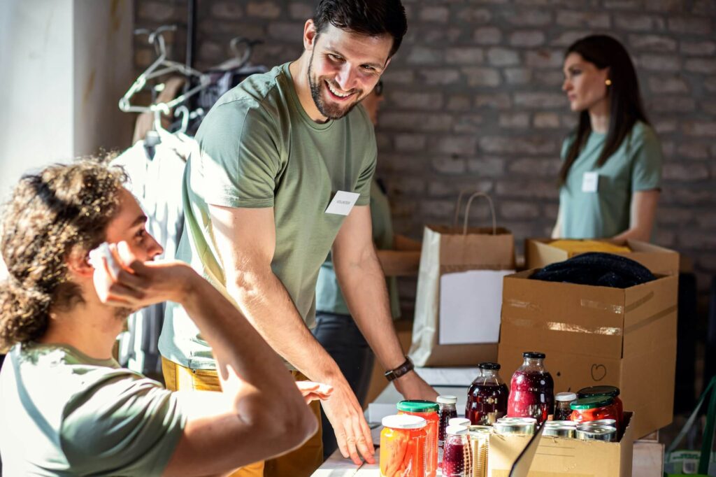 Home group of volunteers with working in community charity donation center  1024x682